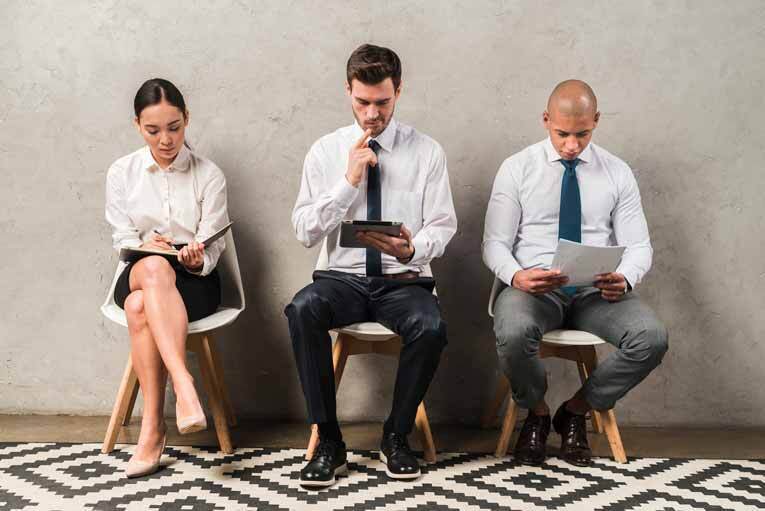 Three candidates waiting for a job interview image