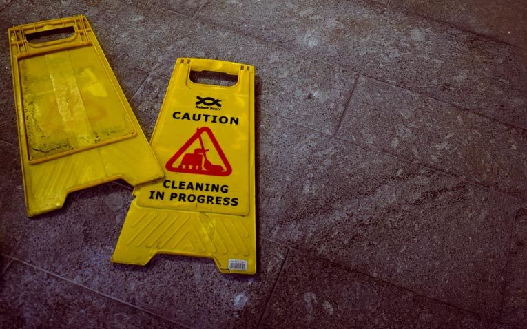 broken yellow caution sign image