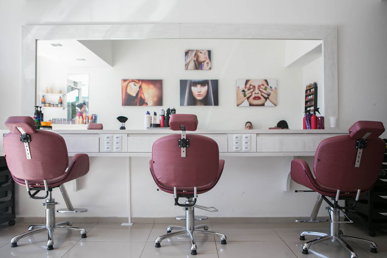 Hair salon with three empty chairs image