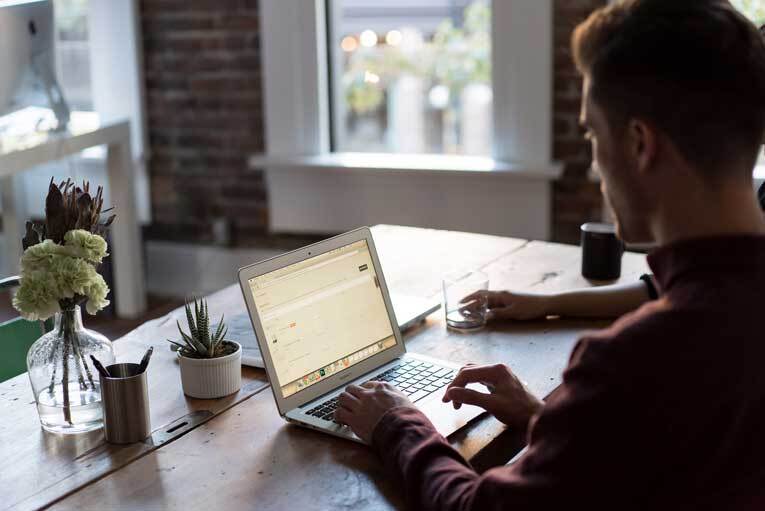 Man working from home on laptop image